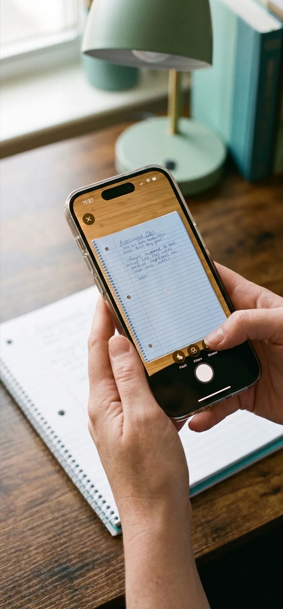 A clinician using the SageReport mobile app to photograph a handwritten note and attach it to a case